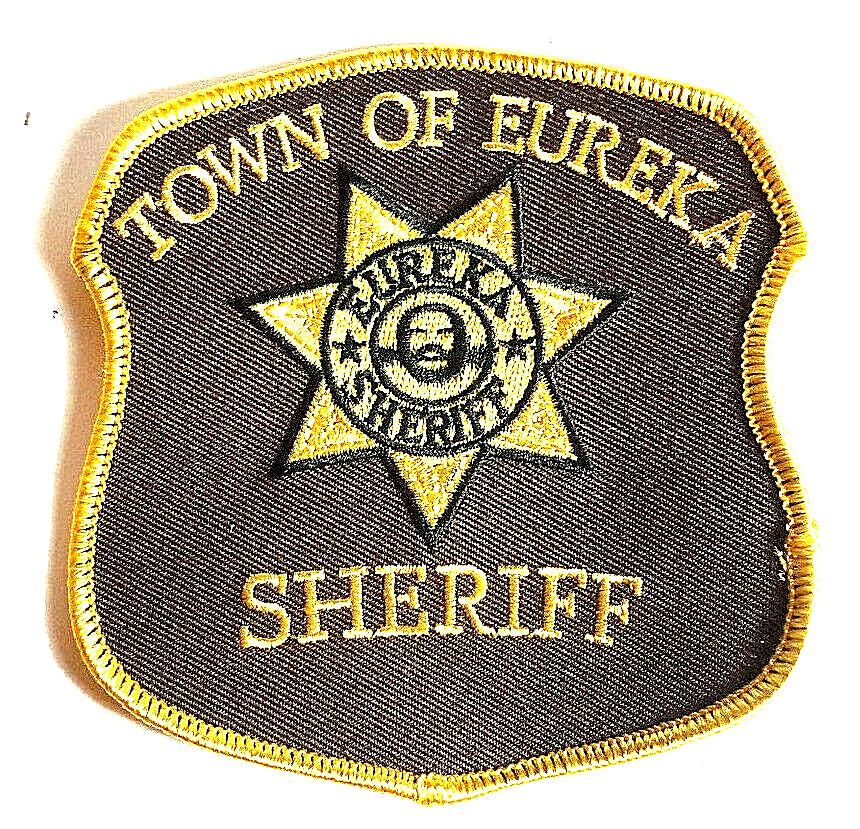 4 inches square, a new Eureka TV Series "Town or Eureka" Sheriff Shoulder Embroidered Patch. Sew or iron on. New.
Please note we will always combine shipping on like items. Any additional patch or pin will ship for 50 cent per item. Any additional payment will be reimbursed to your Paypal account. Thank You.