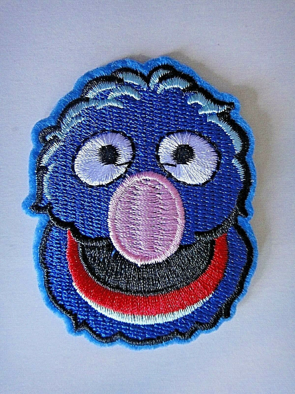 2 7/8 inches tall, a new Sesame Street "Grover's Face" embroidered patch. Sew on or iron on. New.
Please note we will always combine shipping on like items. Any additional patch or pin will ship for 50 cent per item. Any additional payment will be reimbursed to your Paypal account. Thank You.