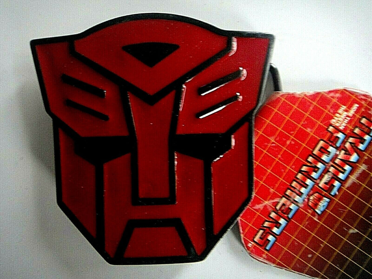 New metal Transformers Autobots Logo Enamel Belt Buckle The features are raised to produce the Autobots face. The belt buckle measures 3. 1/4 inches square. The buckle will accommodate a belt strap upto to 1.5 inches wide. A web belt or any belt strap is not included, only the buckle described.
Please note we will always combine shipping on like items. Any additional patch or pin will ship for 50 cent per item. Any additional payment will be reimbursed to your Paypal account. Thank You.