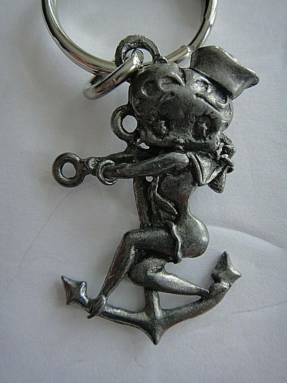 A new Betty Boop "Sailor" Pewter Embossed Key Chain. 2 inches tall but 3 inches tall overall.
Please note we will always combine shipping on like items. Any additional patch or pin will ship for 50 cent per item. Any additional payment will be reimbursed to your Paypal account. Thank You.