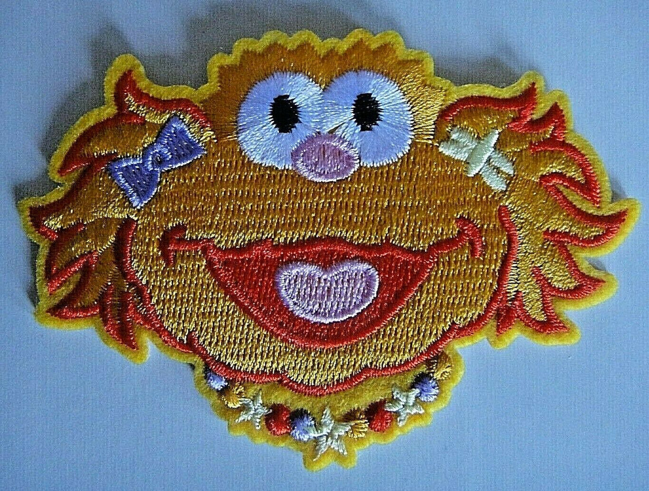 3.5 inches wide, a new Sesame Street "zoe Face" embroidered patch. Sew on or iron on. New.
Please note we will always combine shipping on like items. Any additional patch or pin will ship for 50 cent per item. Any additional payment will be reimbursed to your Paypal account. Thank You.