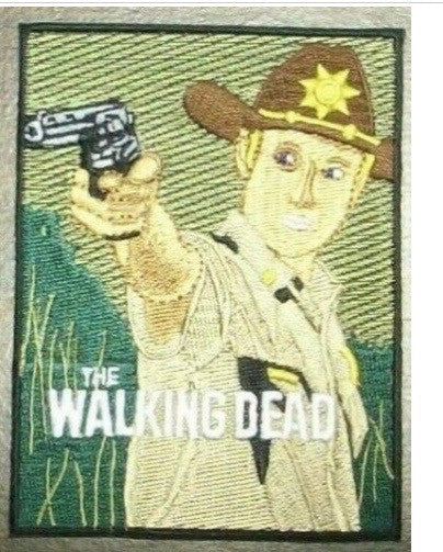 3" wide by 4" tall, a new Walking Dead "Rick, Shooter" embroidered patch. Sew on or iron on. New.

Please note we will always combine shipping on like items.  Any additional patch or pin will ship for 50 cent per item.  Any additional payment will be reimbursed to your Paypal account.  Thank You.