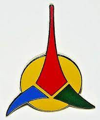 1.75 inches long, a new Star Trek: The Next Generation Klingon Empire Logo Clossaine PIn with pin back clutch.

Please note we will always combine shipping on like items.  Any additional patch or pin will ship for 50 cent per item.  Any additional payment will be reimbursed to your Paypal account.  Thank You.