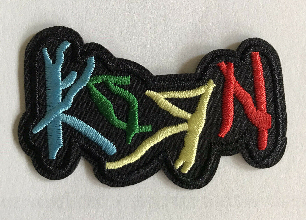 Measures 2. 5/8 inches wide, a new Korn Logo embroidered patch.  Sew on or Iron.  

Please note we will always combine shipping on like items.  Any additional patch or pin will ship for 50 cent per item.  Any additional payment will be reimbursed to your Paypal account.  Thank You.