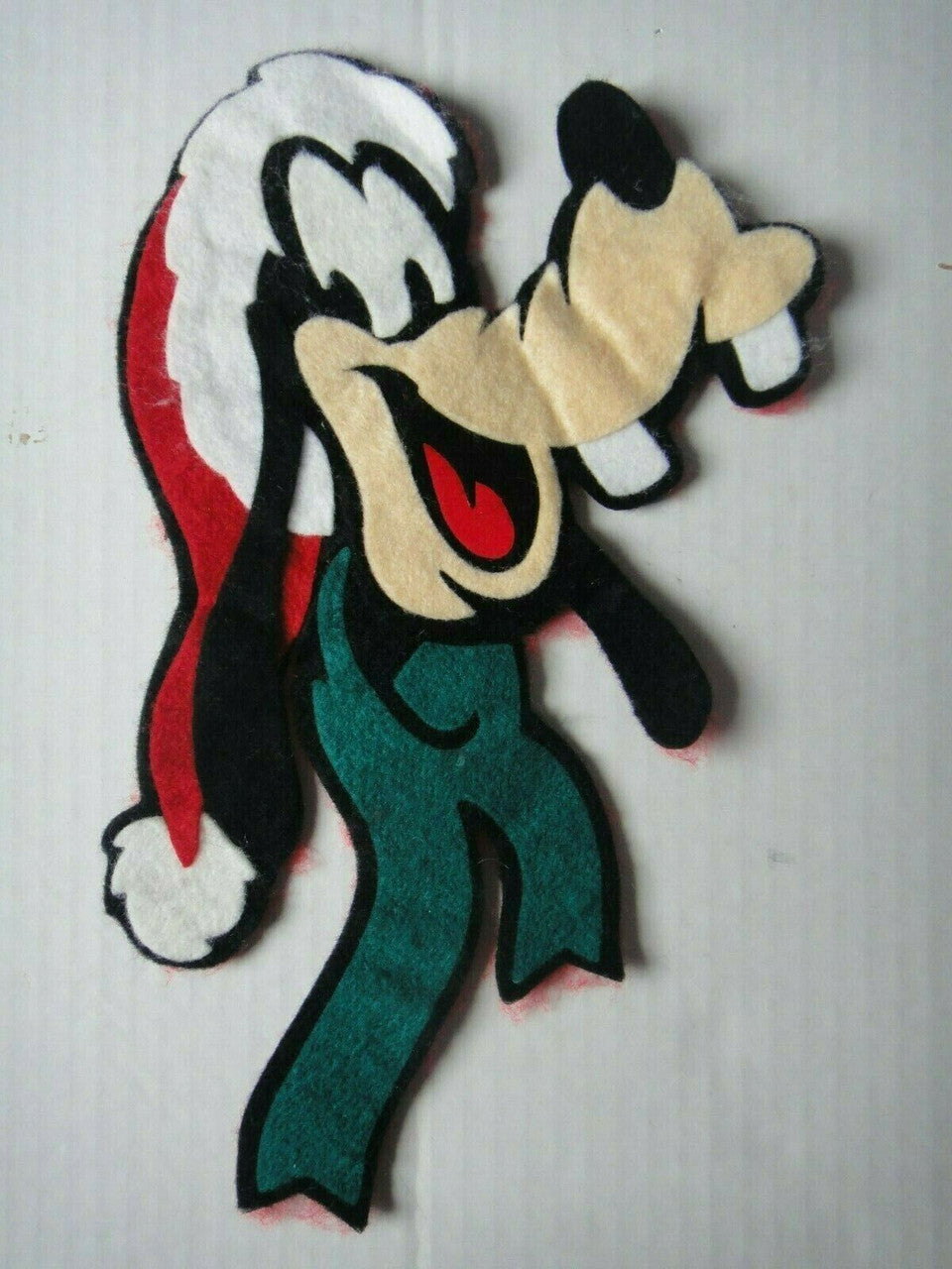 10 inches tall by 6" wide.  a used  Disney "Holiday Goofy" Die-Cut Portrait 10" Jacket embroidered patch. Sew on or iron on. New.
I believe this item is a little older than 10 years.  A recent find from my Canadian warehouse. 

Please note we will always combine shipping on like items.  Any additional patch or pin will ship for 50 cent per item.  Any additional payment will be reimbursed to your Paypal account.  Thank You.