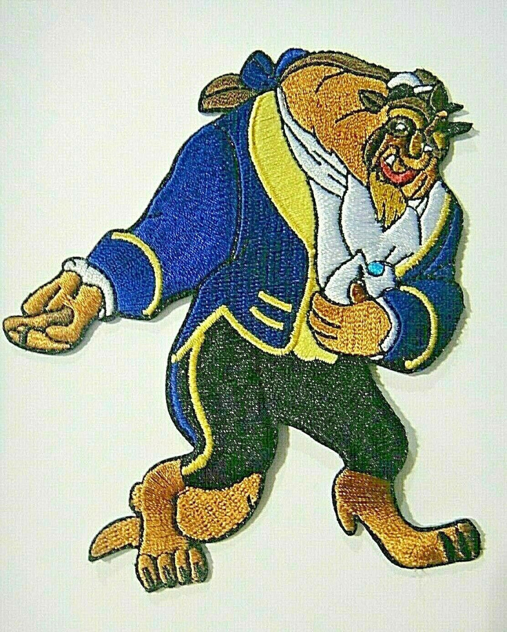4.5 inches tall , a new Beauty and the Beast "Beast takes a Bow" embroidered patch. Sew on or iron on. New.

Please note we will always combine shipping on like items.  Any additional patch or pin will ship for 50 cent per item.  Any additional payment will be reimbursed to your Paypal account.  Thank You.