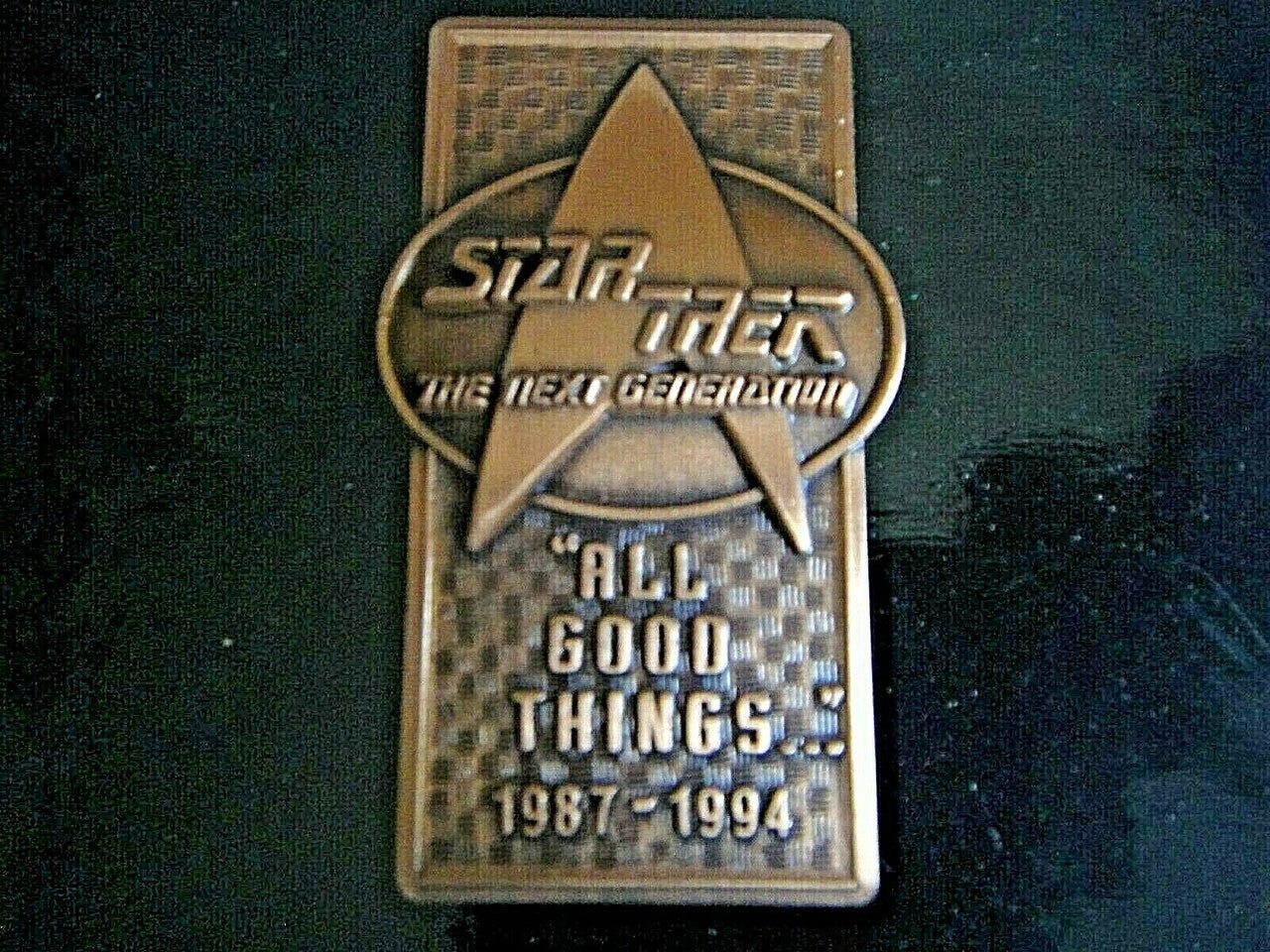 2.25 inch high x 1.125" wide.  a new Star Trek The Next Generation "All Good Things..." Pewter Pin (1987-1994) -  with double clutch back. New.

Please note we will always combine shipping on like items.  Any additional patch or pin will ship for 50 cent per item.  Any additional payment will be reimbursed to your Paypal account.  Thank You.