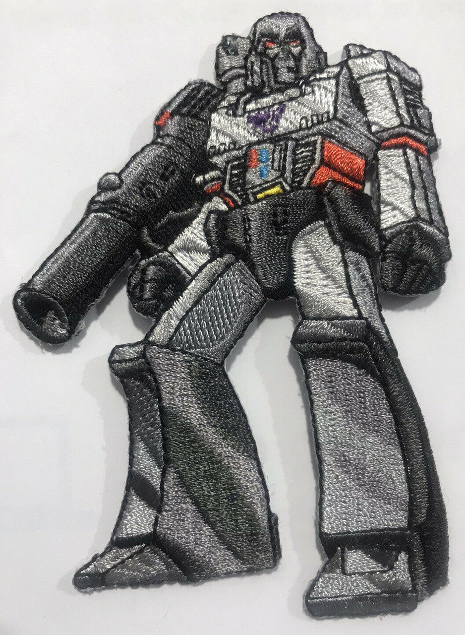 3.5 inches tall, a new Transformers "Megatron" embroidered patch. Sew or iron on. New.

Please note we will always combine shipping on like items.  Any additional patch or pin will ship for 50 cent per item.  Any additional payment will be reimbursed to your Paypal account.  Thank You.