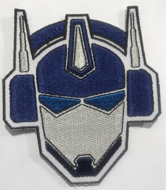 3.5 inches tall, a new Transformers "Bot Face" embroidered patch. Sew or iron on. New.

Please note we will always combine shipping on like items.  Any additional patch or pin will ship for 50 cent per item.  Any additional payment will be reimbursed to your Paypal account.  Thank You.