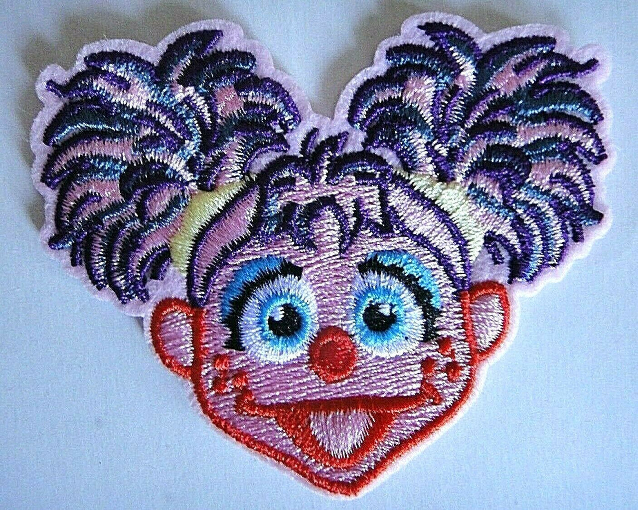 3 inches wide, a new Sesame Street "Abby Cadabby" embroidered patch. Sew on or iron on. New.

Please note we will always combine shipping on like items.  Any additional patch or pin will ship for 50 cent per item.  Any additional payment will be reimbursed to your Paypal account.  Thank You.