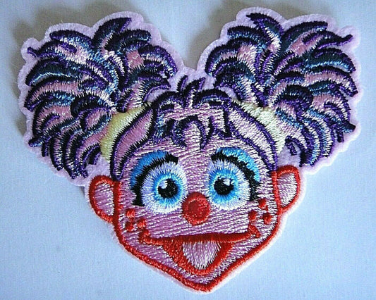 3 inches wide, a new Sesame Street "Abby Cadabby" embroidered patch. Sew on or iron on. New.

Please note we will always combine shipping on like items.  Any additional patch or pin will ship for 50 cent per item.  Any additional payment will be reimbursed to your Paypal account.  Thank You.