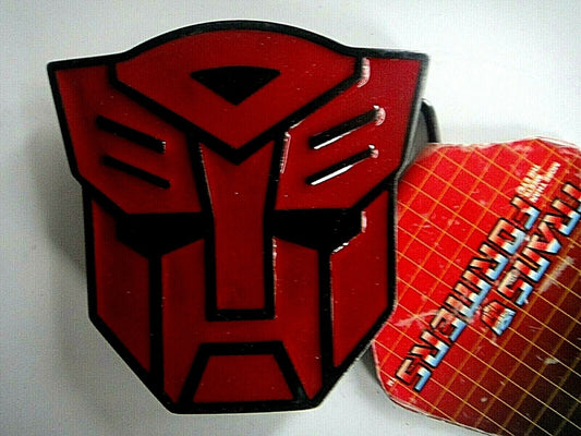 New metal Transformers Autobots Logo Enamel Belt Buckle    The features are raised to produce the Autobots face.  The belt buckle measures 3. 1/4 inches square.  The buckle will accommodate a belt strap upto to 1.5 inches wide.   A web belt or any belt strap is not included,  only the buckle described.  

Please note we will always combine shipping on like items.  Any additional patch or pin will ship for 50 cent per item.  Any additional payment will be reimbursed to your Paypal account.  Thank You.