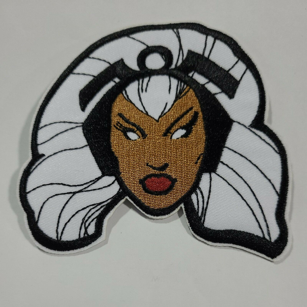 3.5 inches in diameter, a new Marvel The Uncanny X-Men Storm "Portrait" embroidered patch. Sew on or iron on. New.

Please note we will always combine shipping on like items.  Any additional patch or pin will ship for 50 cent per item.  Any additional payment will be reimbursed to your Paypal account.  Thank You.
