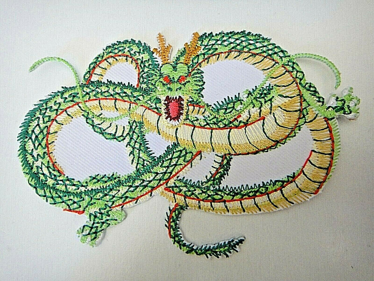 4 inches wide, a new Martial Arts Dragon Snake "Strike" embroidered patch. Sew on or iron on. New. 

Please note we will always combine shipping on like items. Any additional patch or pin will ship for 50 cent per item. Any additional payment will be reimbursed to your Paypal account. Thank You. 