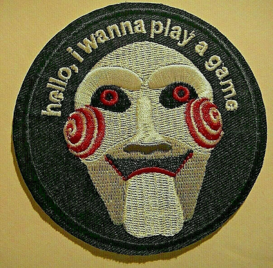 3 inches diameter,  a new Jigsaw "SAW" Hello, I wanna Play A Game embroidered patch. Sew on or iron on.

Please note we will always combine shipping on like items.  Any additional patch or pin will ship for 50 cent per item.  Any additional payment will be reimbursed to your Paypal account.  Thank You.
