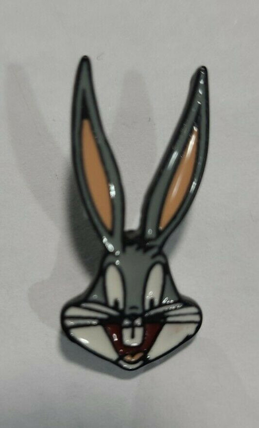  1 inches tall, a new Bugs Bunny "Face" enamel pin with clutch back.

Please note we will always combine shipping on like items.  Any additional patch or pin will ship for 50 cent per item.  Any additional payment will be reimbursed to your Paypal account.  Thank You.