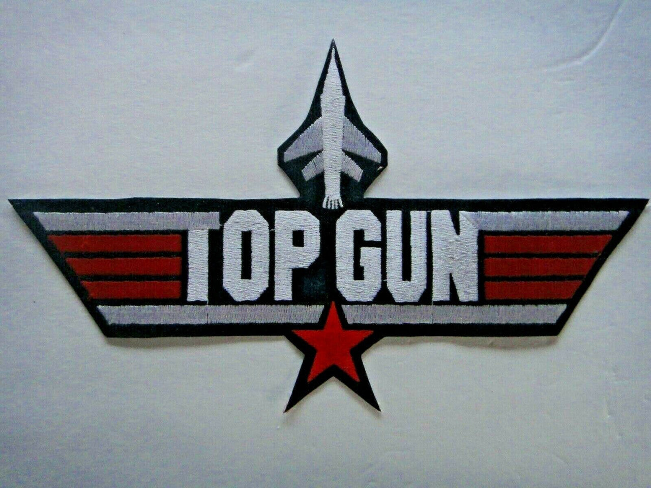 11 inches wide, a new Top Gun Motion Picture 11 inch Jacket Embroidered Patch. Sew or iron on. New.
Over 20 years in my collection.  

Please note we will always combine shipping on like items.  Any additional patch or pin will ship for 50 cent per item.  Any additional payment will be reimbursed to your Paypal account.  Thank You.