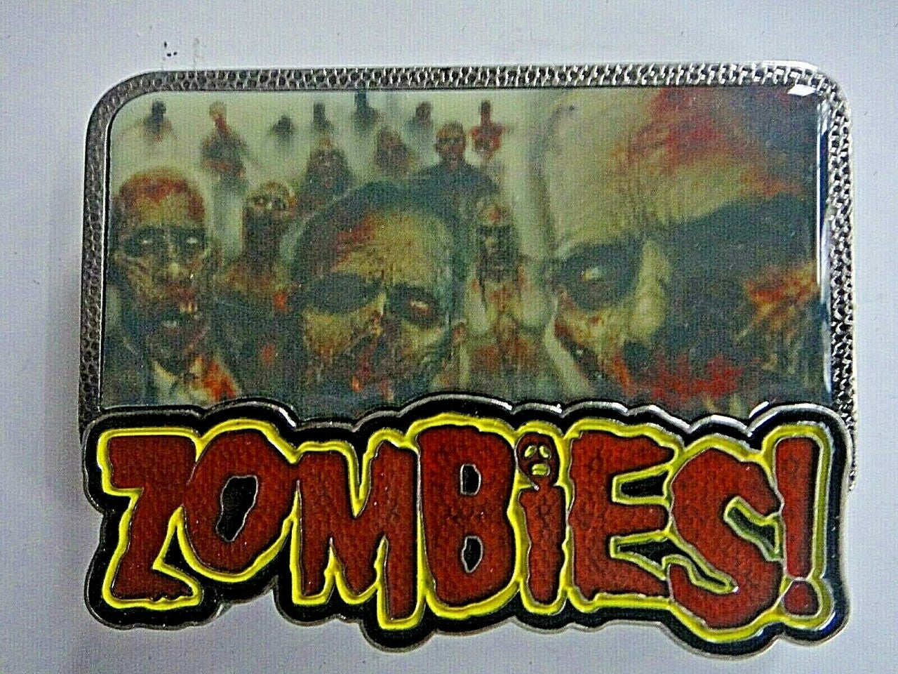 New Walking Dead "Zombie" enamel Belt Buckle.  The belt buckle measures 3.75 inches wide by 2.75 inches tall.  The buckle will accommodate a belt strap upto to 1.5 inches wide.   A web belt or any belt strap is not included,  only the buckle described.   

Please note we will always combine shipping on like items.  Any additional patch or pin will ship for 50 cent per item.  Any additional payment will be reimbursed to your Paypal account.  Thank You.