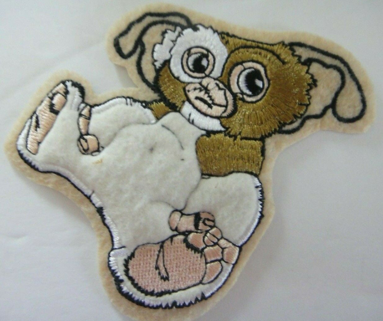 4 inches tall, a new Gremlins "The Motion Picture" puffy embroidered patch. Sew on or iron on. New

Please note we will always combine shipping on like items.  Any additional patch or pin will ship for 50 cent per item.  Any additional payment will be reimbursed to your Paypal account.  Thank You.