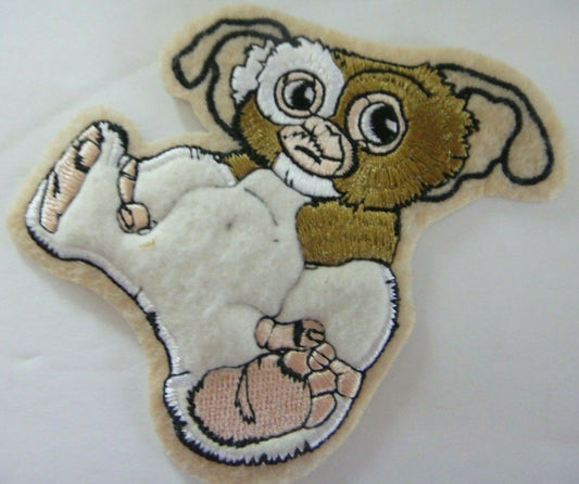 4 inches tall, a new Gremlins "The Motion Picture" puffy embroidered patch. Sew on or iron on. New

Please note we will always combine shipping on like items.  Any additional patch or pin will ship for 50 cent per item.  Any additional payment will be reimbursed to your Paypal account.  Thank You.