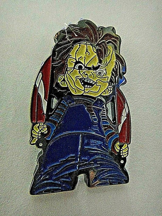 1. 1/2" inches tall, a new Child's Play "Chucky" enamel pin with a metal post and rubber back. New.  

Please note we will always combine shipping on like items.  Any additional patch or pin will ship for 50 cent per item.  Any additional payment will be reimbursed to your Paypal account.  Thank You.