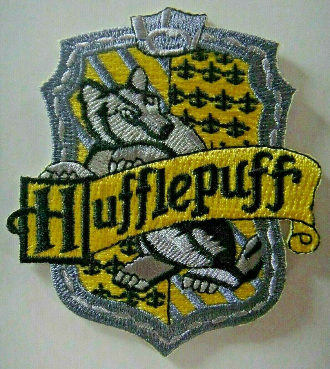 3 3/8 inches tall, Harry Potter "House of Hufflepuff" embroidered patch.  Sew or iron on. New

Please note we will always combine shipping on like items.  Any additional patch or pin will ship for 50 cent per item.  Any additional payment will be reimbursed to your Paypal account.  Thank You.