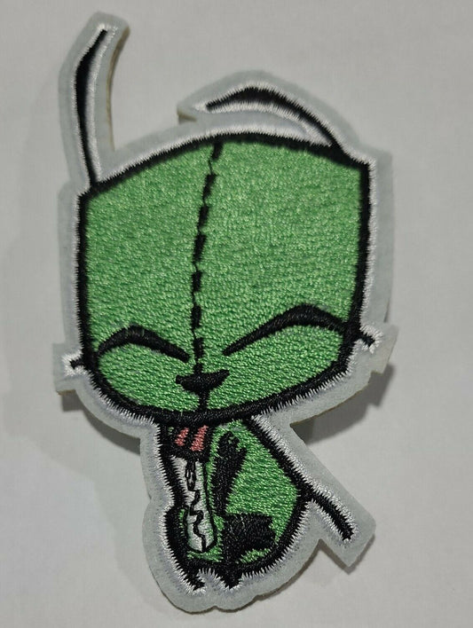 4. 3/4 inches tall,  a new GIR with his eyes closed embroidered patch.   Sew on or iron on. 
(Garbage-issue Information Retrieval) the dim witted robot from the cartoon series "Invader Zim" is featured on his own embroidered patch. New.

Please note we will always combine shipping on like items.  Any additional patch or pin will ship for 50 cent per item.  Any additional payment will be reimbursed to your Paypal account.  Thank You.