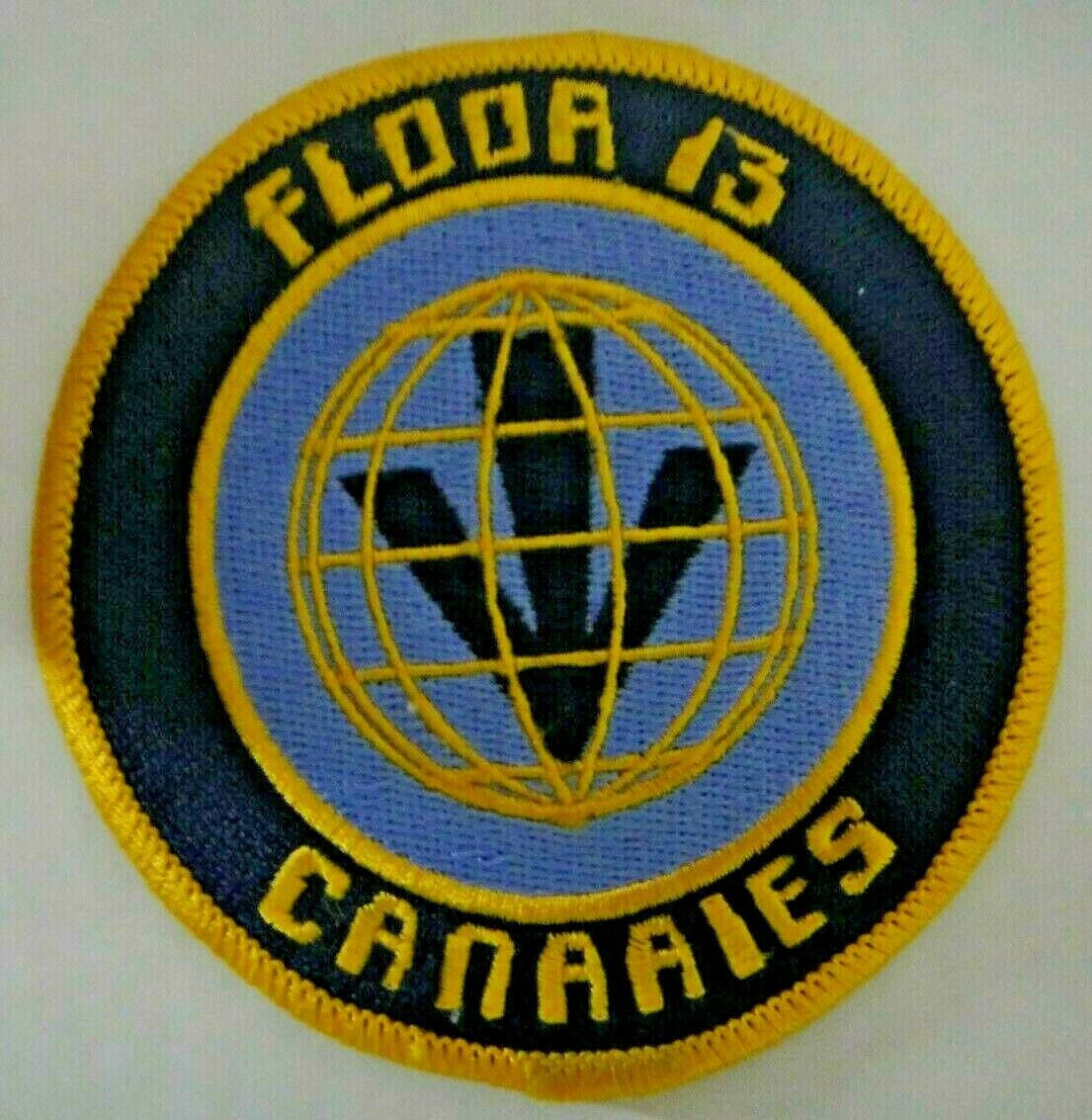 3.5 inches wide,  a new Red Dwarf "Floor" Logo  13 Canaries" Logo Embroidered Patch.  Sew on or iron. 

Please note we will always combine shipping on like items.  Any additional patch or pin will ship for 50 cent per item.  Any additional payment will be reimbursed to your Paypal account.  Thank You.