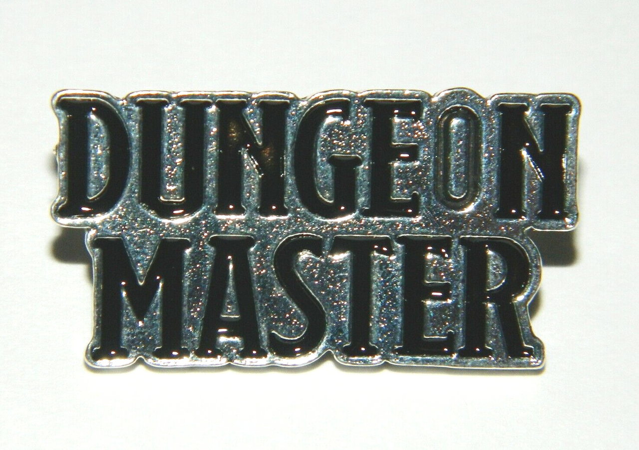 1  3/8 inch wise,  Dungeon & Dragons, Dungeon Master Name Logo Metal Pin witt a post and butterfly back.

Please note we will always combine shipping on like items.  Any additional patch or pin will ship for 50 cent per item.  Any additional payment will be reimbursed to your Paypal account.  Thank You.
