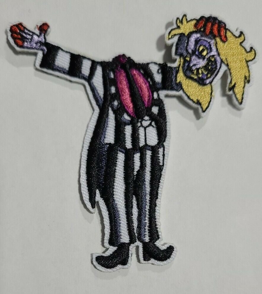 3.25 inches wide,  a new Bettlejuice "Holding His Head" embroidered patch. Sew on or iron on.

Please note we will always combine shipping on like items.  Any additional patch or pin will ship for 50 cent per item.  Any additional payment will be reimbursed to your Paypal account.  Thank You.