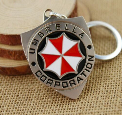 New Resident Evil "Umbrella Corporation" Enamel metal key chain. Measures 2.25 inches tall without the chain or loop.  

Please note we will always combine shipping on like items.  Any additional patch or pin will ship for 50 cent per item.  Any additional payment will be reimbursed to your Paypal account.  Thank You.
